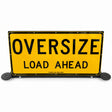 Oversize Load Ahead pilot vehicle sign raised upright on its black steel frame, with beacon plates fitted either side