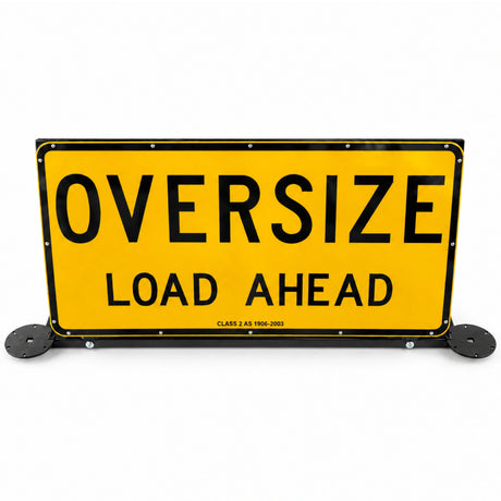 Oversize Load Ahead pilot vehicle sign raised upright on its black steel frame, with beacon plates fitted either side
