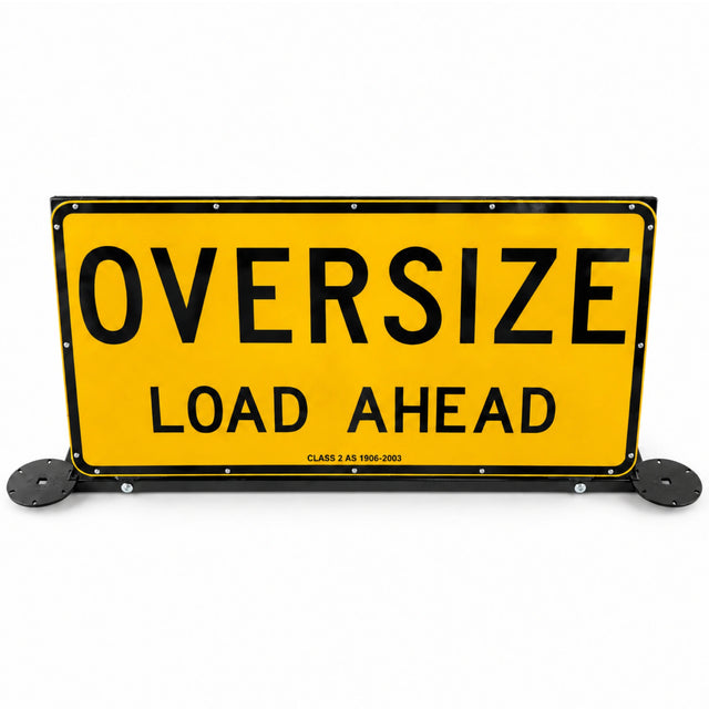 Oversize Load Ahead pilot vehicle sign raised upright on its black steel frame, with beacon plates fitted either side