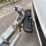 Black Stepmate towbar step left fitted with a galvanised trailer coupled to the tow ball