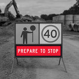 traffic control temporary sign warning of a prepare to stop ahead with machinery in the background