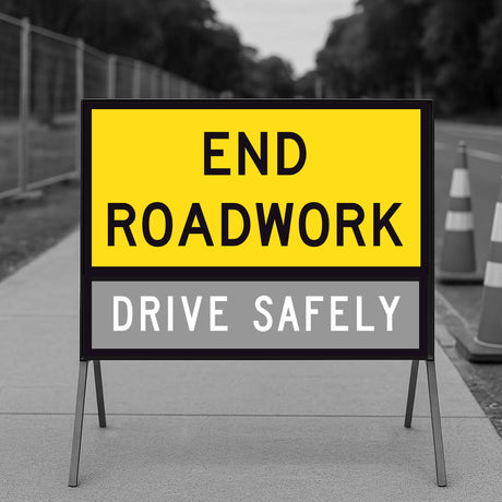 TM2-17C Roadwork sign indicating end of roadwork and safety message on a blurred background