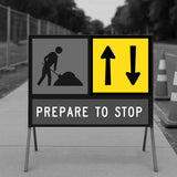 Construction sign with warning symbols and text 'Prepare to Stop' on a road.