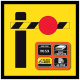 Boom Barrier Safety sign with a red circle, black bar, and certification details on a yellow background