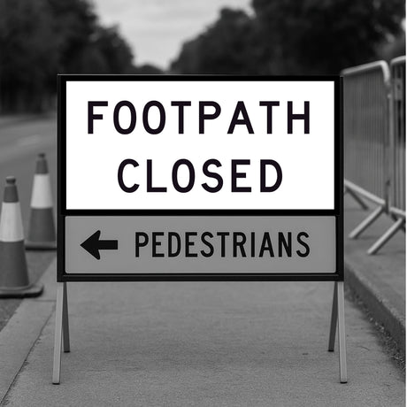 Footpath closed sign with an arrow pointing left on a sidewalk.